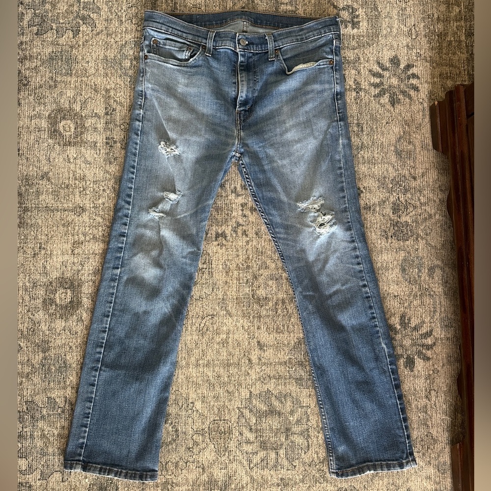 Levi’s 513 slim straight naturally distressed jeans